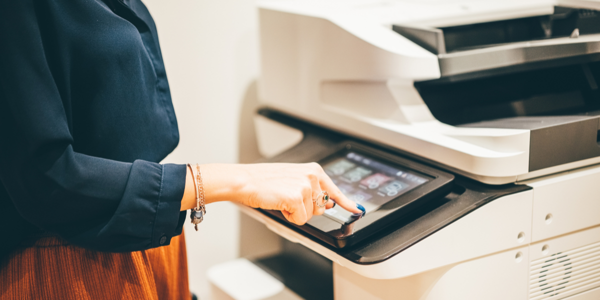 woman touching printer screen