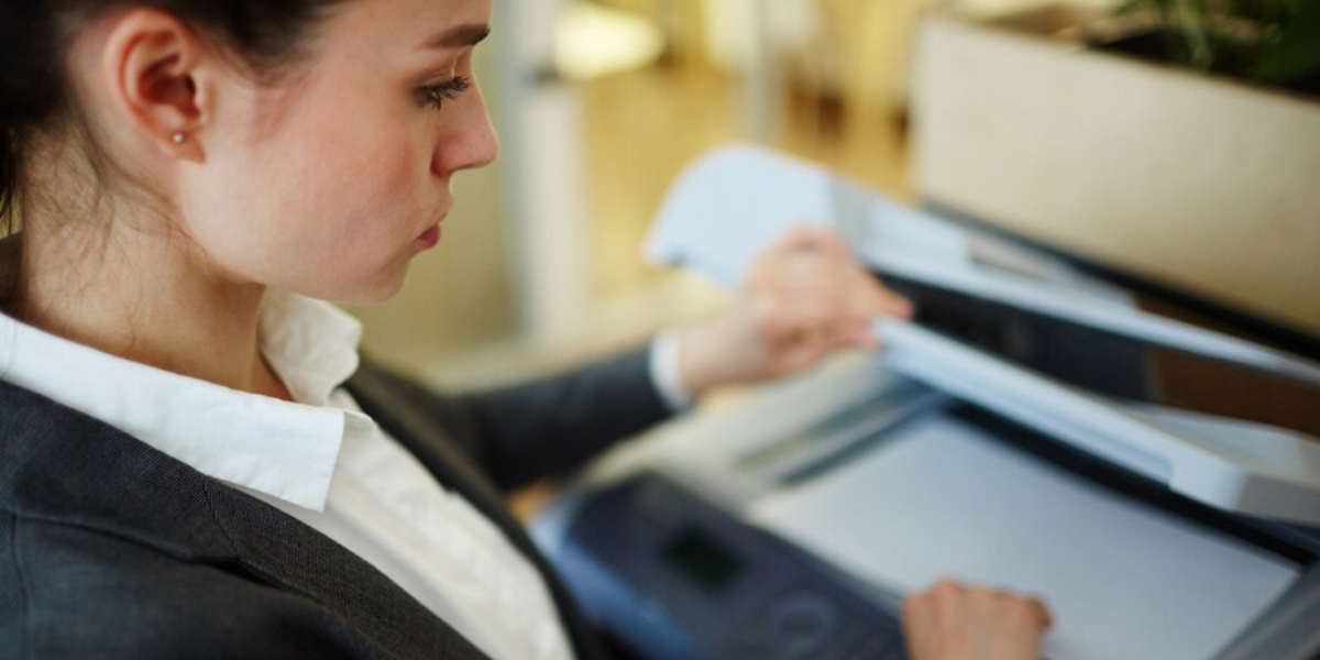 Professional person using an office machine.