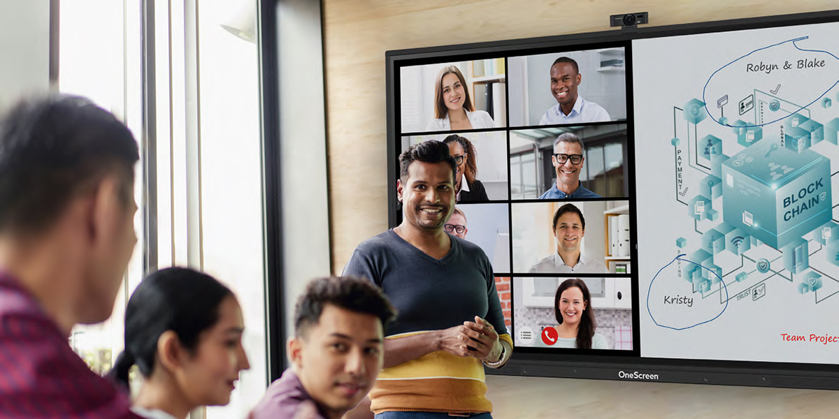 man giving presentation on video conference using OneScreen touchscreen