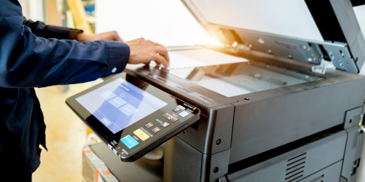 man scanning document on leased office equipment