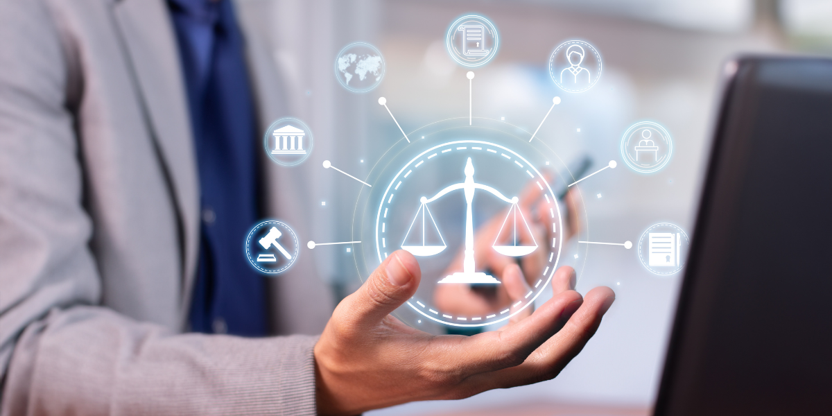 Hand holding graphic of legal scales with law related icons such as gavels and documents surrounding it.