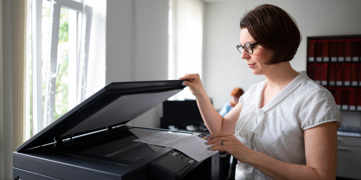 woman printing while keeping data secure with managed print services