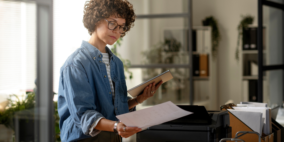 Woman calculating her printing costs per page