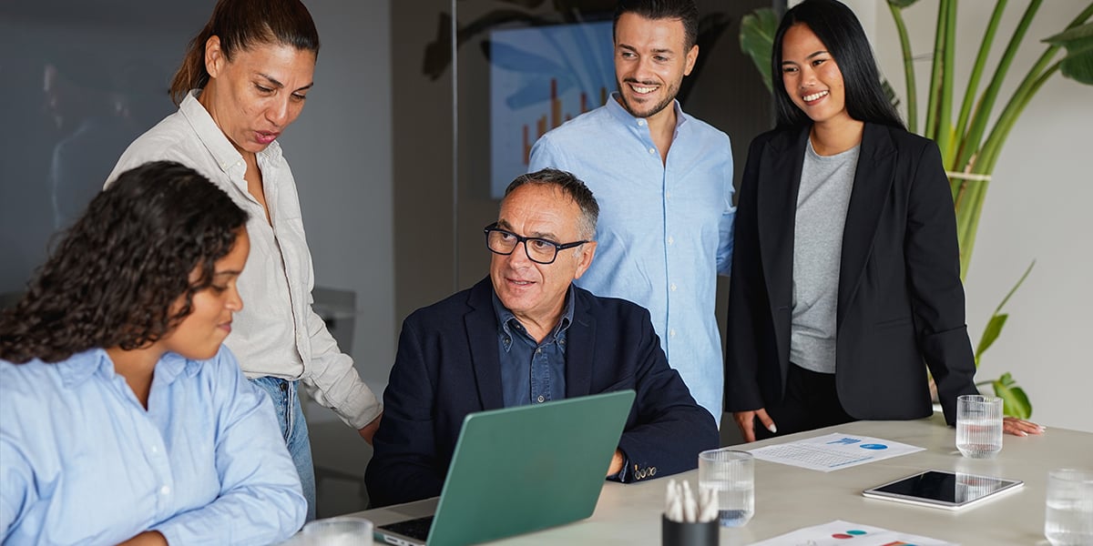 Multiracial business people working together inside modern office sharing ideas