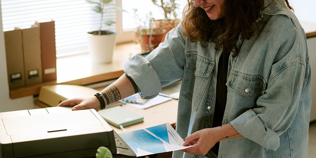 woman retrieving document from printer
